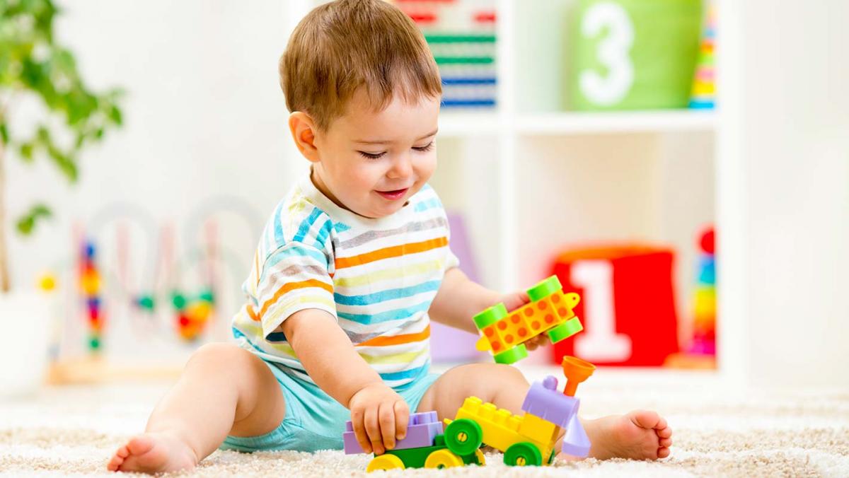 Baby boy playing with his lego