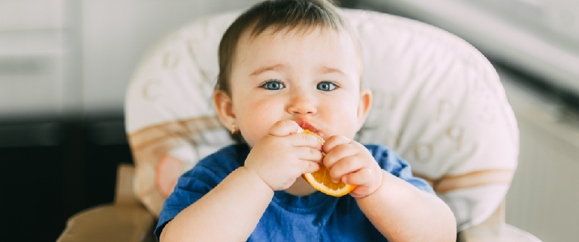 baby eating solid food